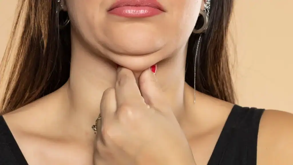 An image of a woman with double chin, sad, worried : Non Surgical Double Chin Removal Treatment in Stansted, UK